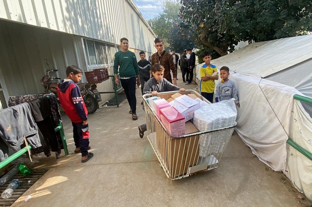 PHOTO: Yazan Fasfous, 13, volunteers to help distribute medical supplies at the European Gaza Hospital, where his mother works, amid the ongoing conflict between Israel and the Palestinian Islamist group Hamas, in Khan Younis, Gaza Strip, Dec. 8, 2023. 