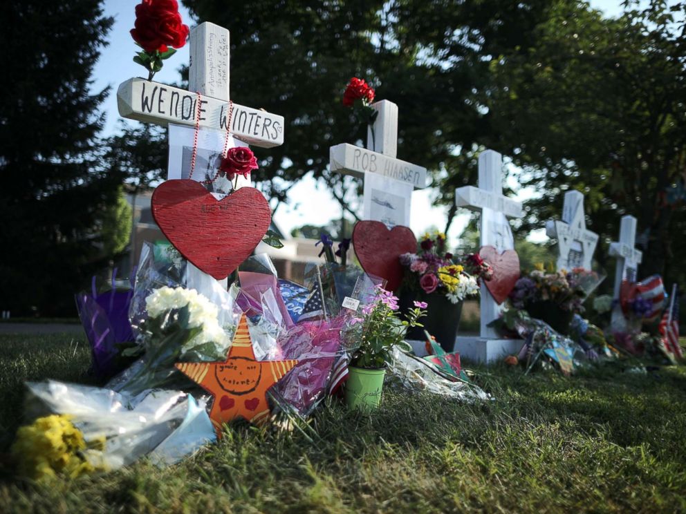 PHOTO: Five wood markers stand in a makeshift memorial outside the Annapolis Capitol Gazette offices for the employees killed by a gunman last week, July 2, 2018, in Annapolis, Md.