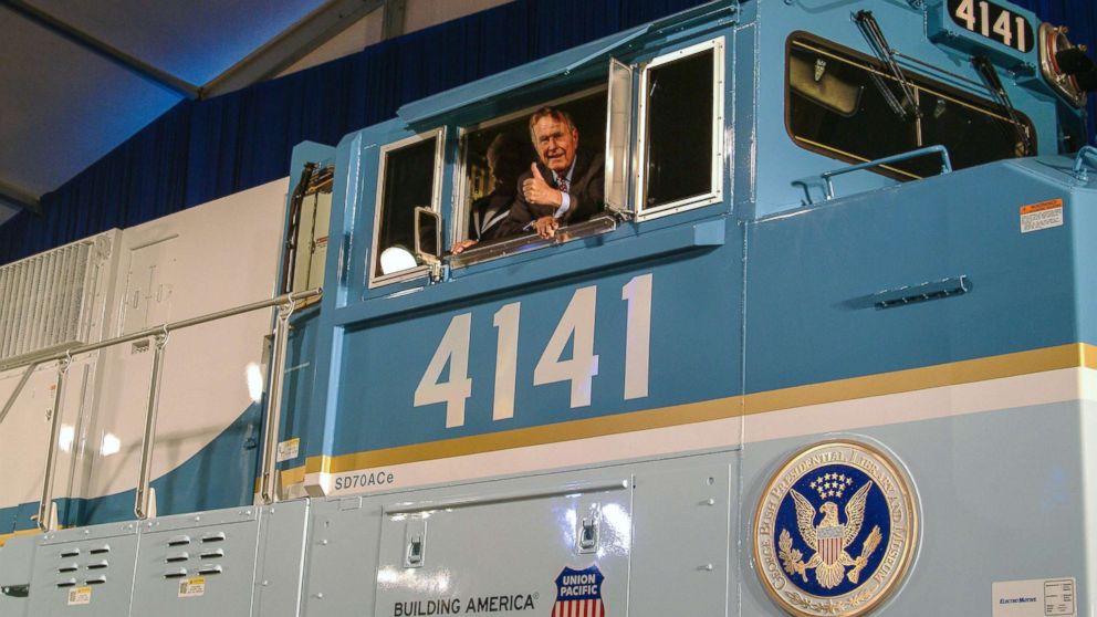 PHOTO: Former President George H.W. Bush gives a thumbs-up from the cab of Union Pacific Locomotive No. 4141 at its unveiling in 2005.