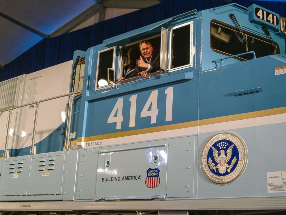 PHOTO: Former President George H.W. Bush gives a thumbs-up from the cab of Union Pacific Locomotive No. 4141 at its unveiling in 2005.