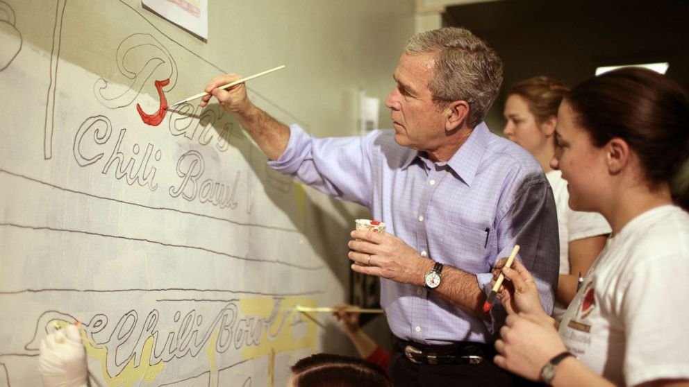 PHOTO: President George W. Bush helps volunteers paint a mural at a high school during the Martin Luther King Jr day of service in Washington, Jan. 15, 2007. 