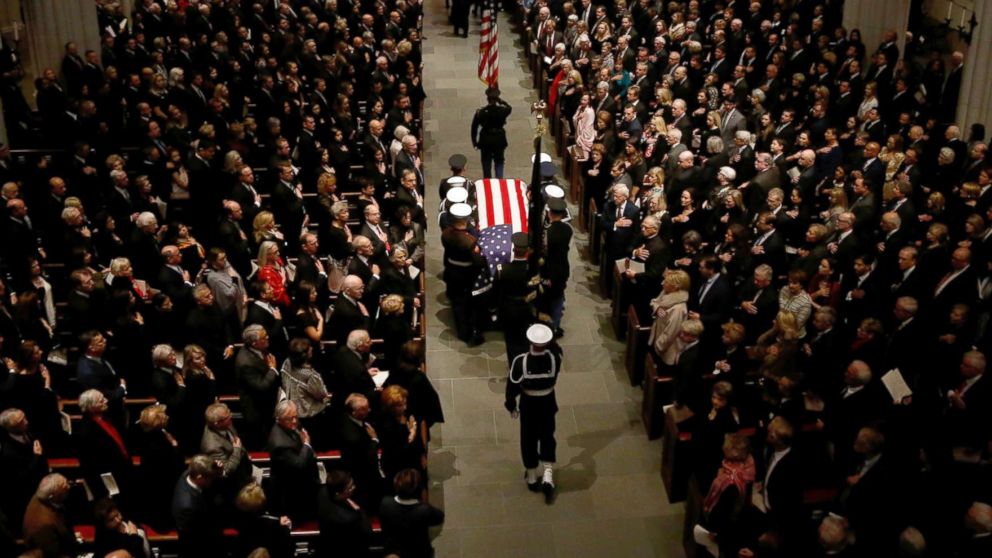 PHOTO: The flag-draped casket of former President George H.W. Bush is carried by a joint services military honor guard into St. Martin's Episcopal Church, Dec. 6, 2018, in Houston.