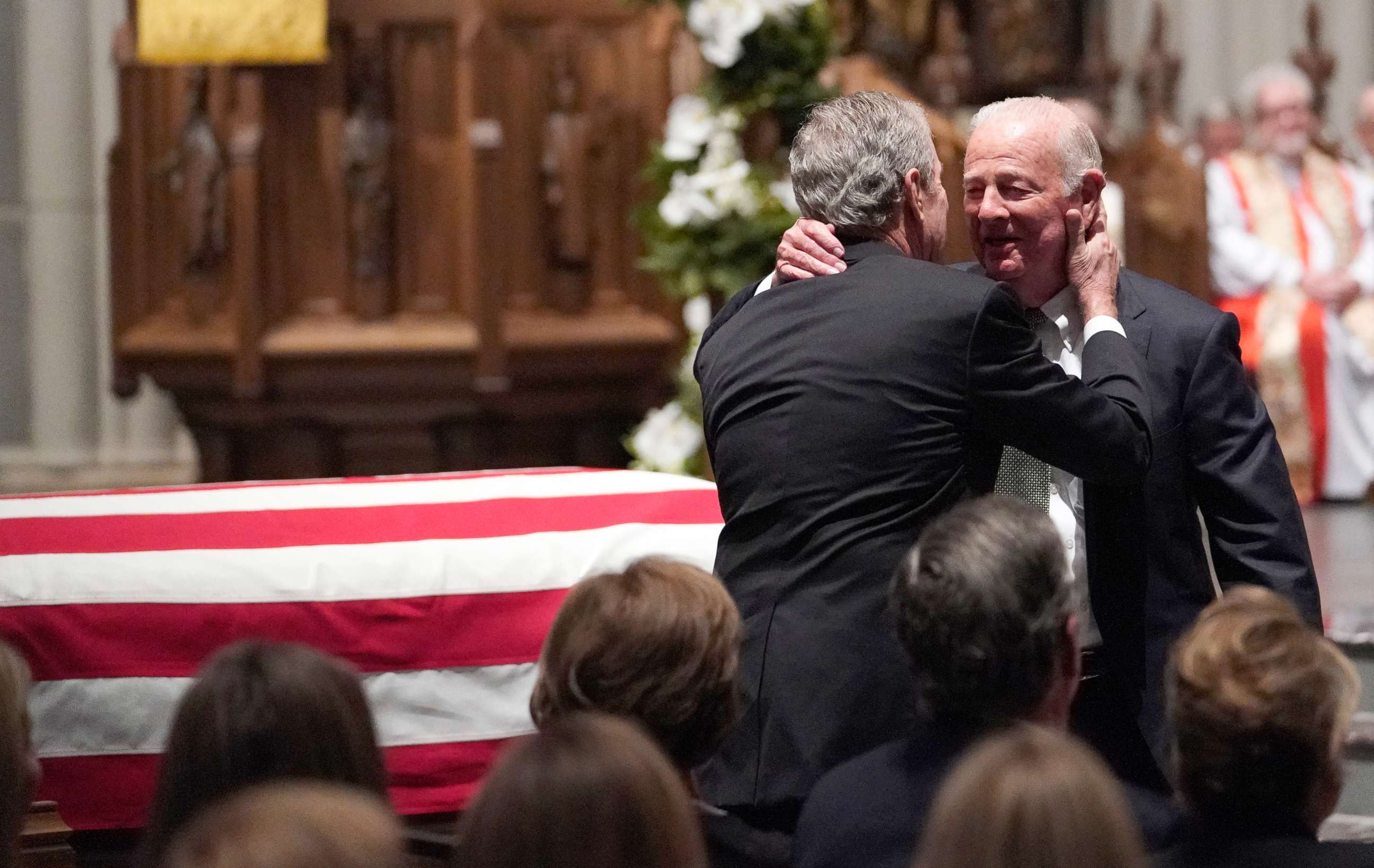 PHOTO: Former President George W. Bush embraces former Secretary of State James Baker, right, after he gave a eulogy during the funeral for former President George H.W. Bush at St. Martin's Episcopal Church, Dec. 6, 2018, in Houston.