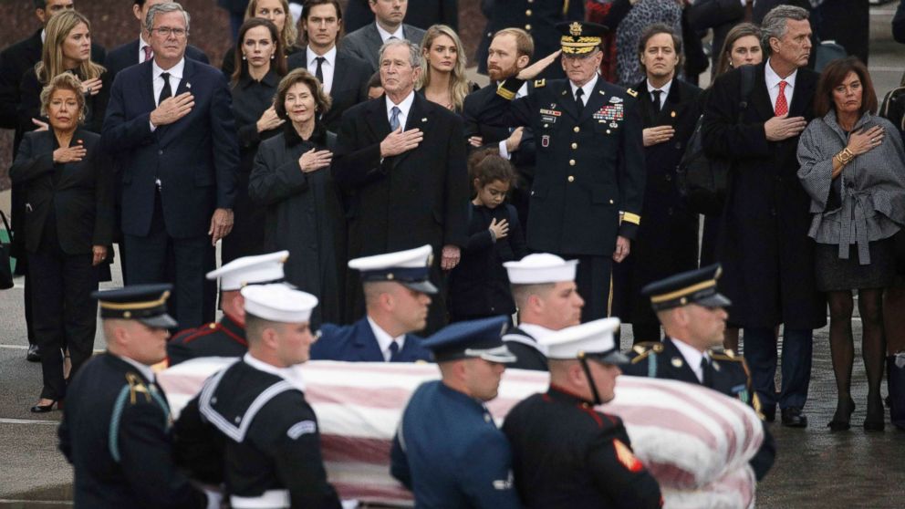 PHOTO: The Bush family looks on as a joint military services honor guard carries the casket for former President George H.W. Bush  from the Union Pacific funeral train at Texas A&M University in College Station, Texas, Dec. 6, 2018.