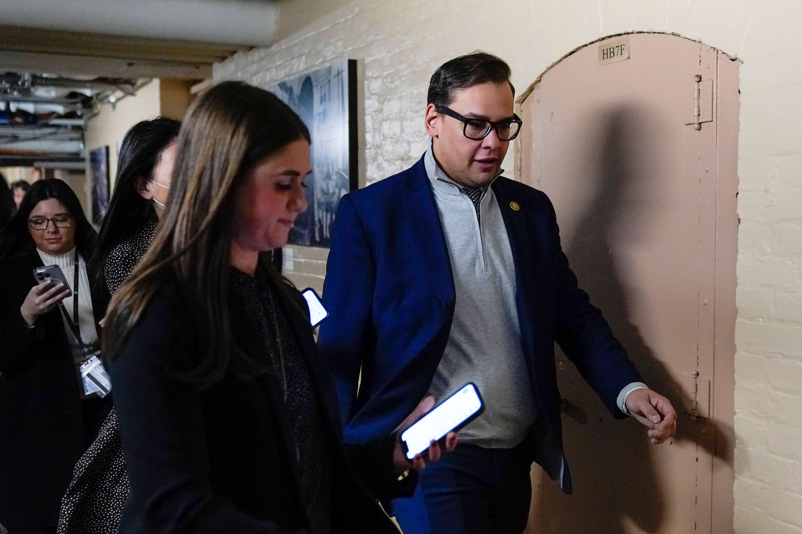 PHOTO: Rep. George Santos talks with reporters after attending a House GOP conference meeting on Capitol Hill in Washington, Jan. 10, 2023.