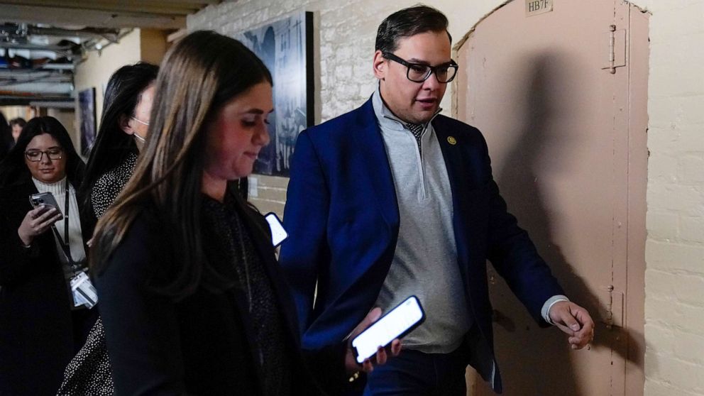 PHOTO: Rep. George Santos talks with reporters after attending a House GOP conference meeting on Capitol Hill in Washington, Jan. 10, 2023.