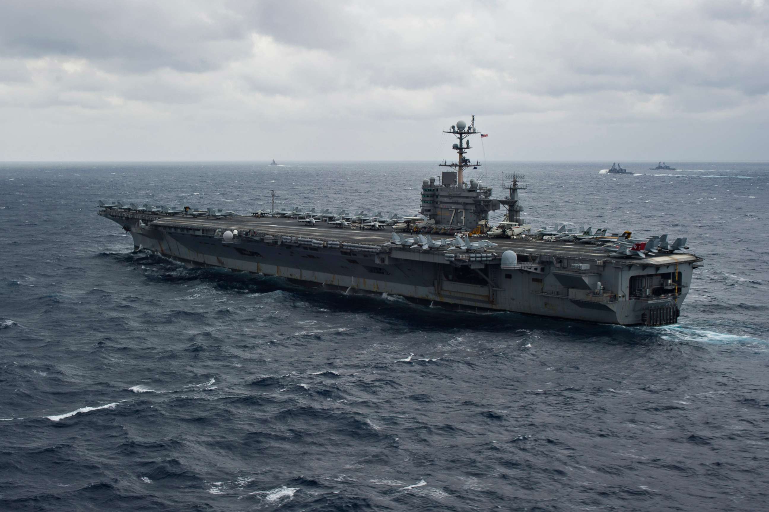 PHOTO: The U.S. Navy's forward deployed aircraft carrier USS George Washington (CVN 73) and Japan Maritime Self-Defense Force ships participate in tactical maneuver training during Annual Exercise, Nov. 28, 2013.