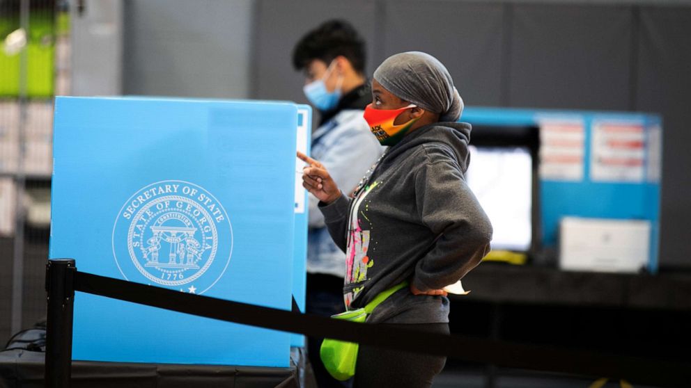 PHOTO: A Gwinnett county voter casts a ballot at Lucky Shoals Park polling station on Nov. 3, 2020, in Norcross, Ga. 