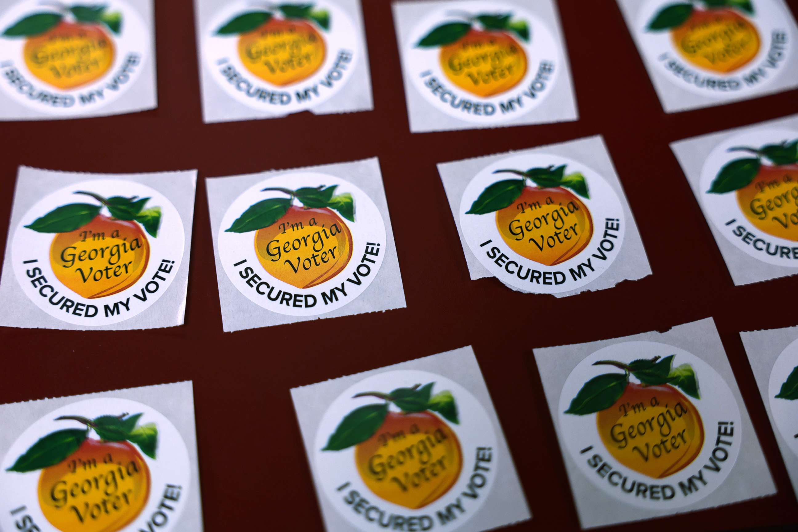 PHOTO: A few "I'm a Georgia Voter, I Secured My Vote!" stickers are seen at a polling place, Nov. 8, 2022 in Sandy Springs, Ga.