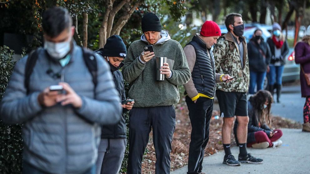 PHOTO: Voters wait on line to to cast their votes on Election Day, Nov. 3, 2020, in Atlanta. 