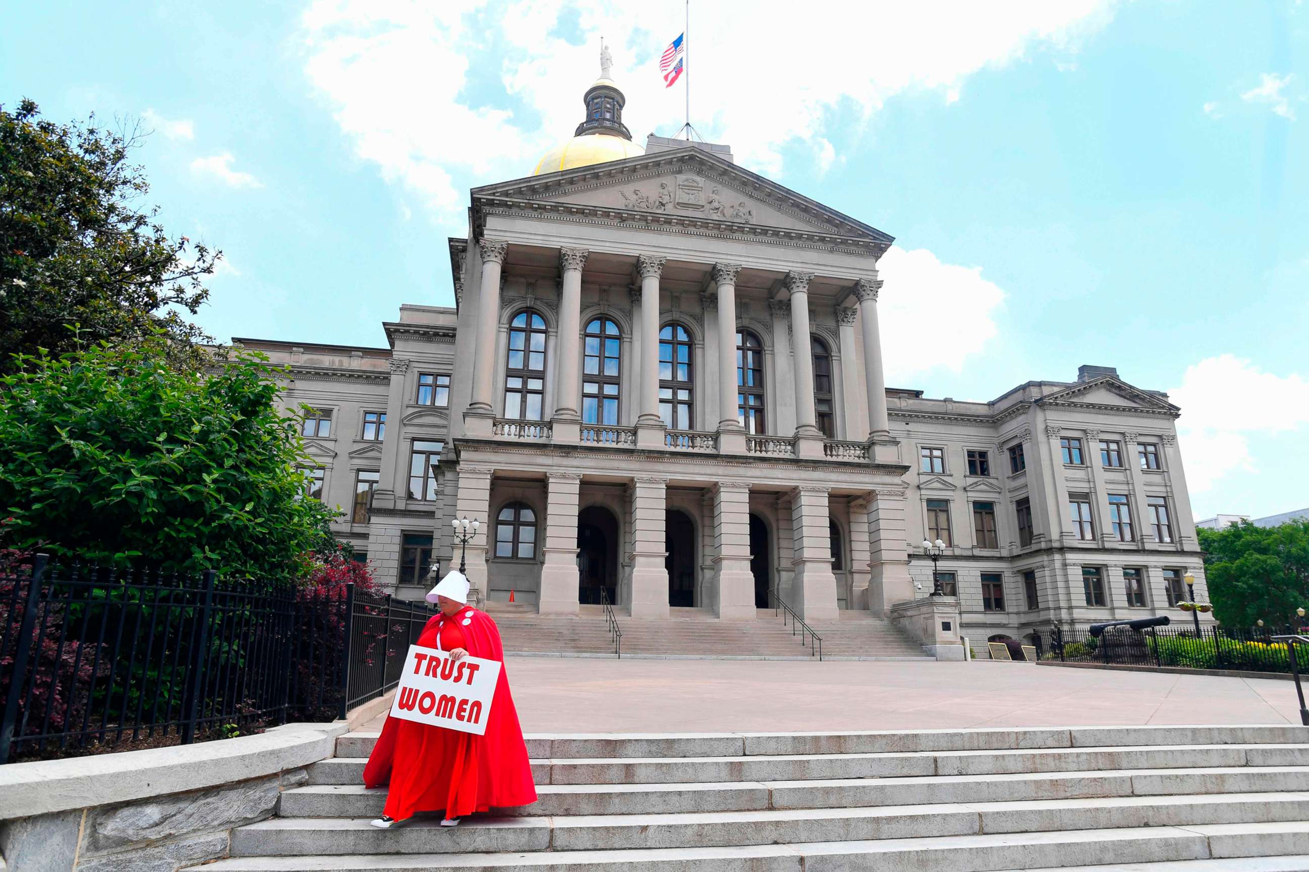 PHOTO: Activist Tamara Stevens with the Handmaids Coalition of Georgia leaves the Georgia Capitol, May 16, 2019 in Atlanta.