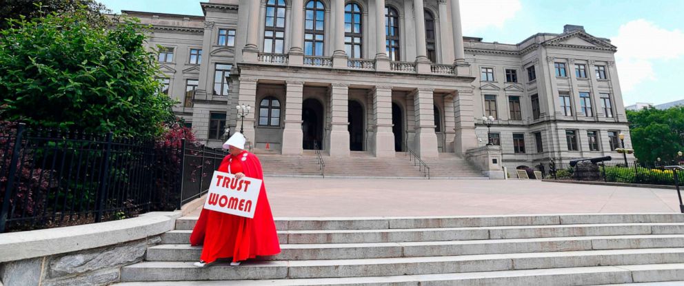 PHOTO: Activist Tamara Stevens with the Handmaids Coalition of Georgia leaves the Georgia Capitol, May 16, 2019 in Atlanta.