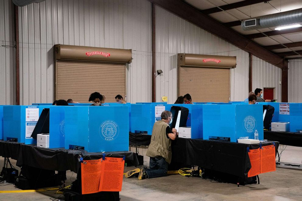 PHOTO: People cast their ballots at an early voting location at the Gwinnett County Fairgrounds, Oct. 24, 2020, in Lawrenceville, Georgia.