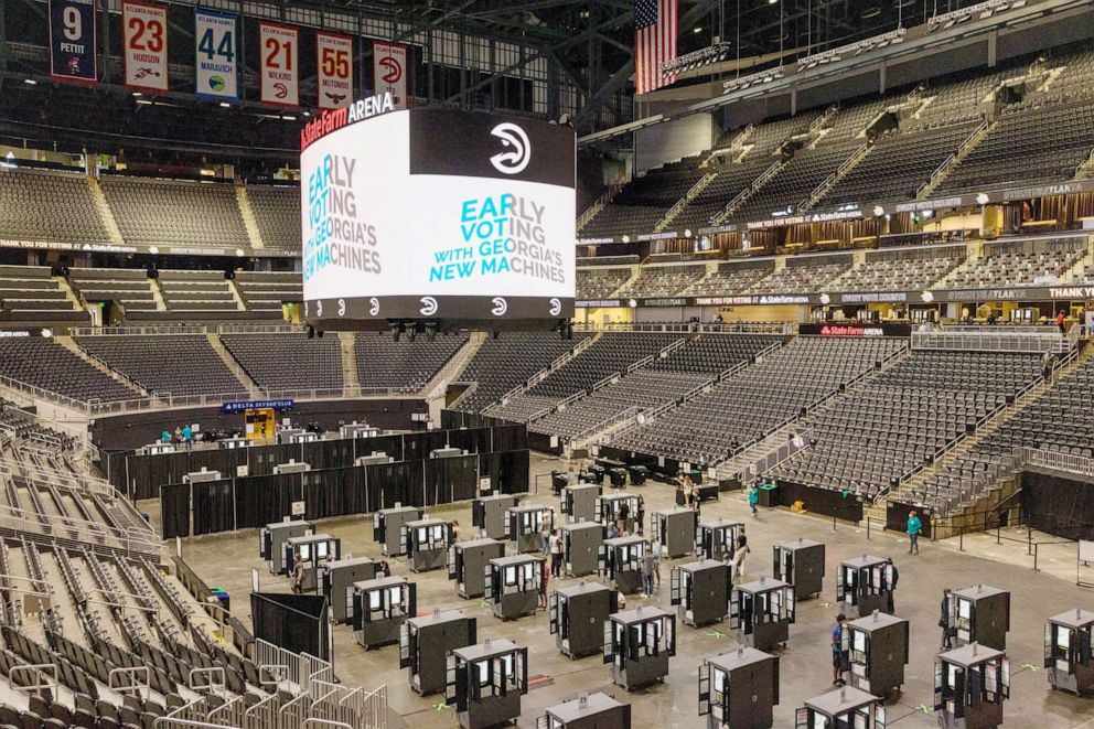 PHOTO: Early voting at State Farm Arena in Atlanta, where problems with electronic equipment were reported, Oct. 12, 2020.