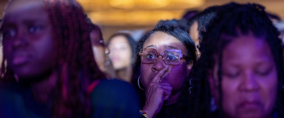 PHOTO: Supporters of U.S. Senator Raphael Warnock attend an election night party after polls closed for the U.S. midterm runoff election, Dec. 6, 2022, in Atlanta. 