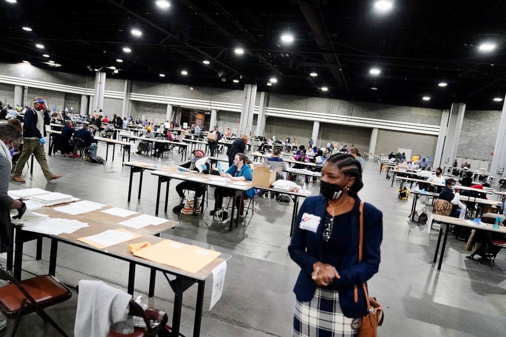 PHOTO: Officials sort ballots during an audit at the Georgia World Congress Center in Atlanta, Nov. 14, 2020.)