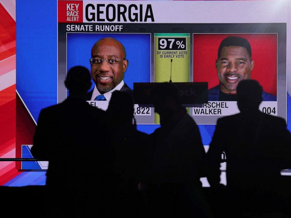 PHOTO: Supporters of Reverend Raphael Warnock attend a election night party after polls closed for the U.S. midterm runoff elections between Warnock and his Republican challenger Herschel Walker in Atlanta, on Dec. 6, 2022.