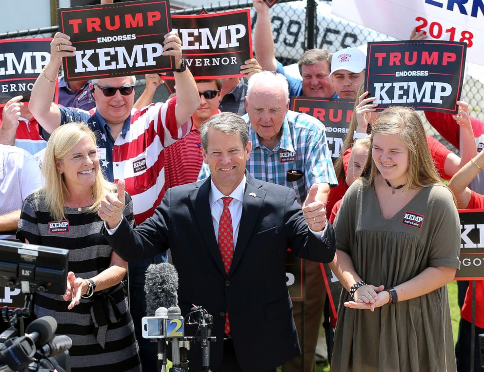 PHOTO: State Secretary Brian Kemp, accompanied by his wife Marty and his daughter Lucy, agrees for the first leg of his campaign during his first flight around Georgians at Peachtree DeKalb Airport, July 23, 2018 in Atlanta. 