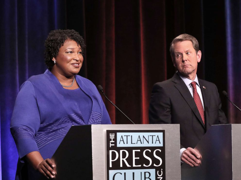 PHOTO: Georgia gubernatorial candidates (L-R) Democrat Stacey Abrams and Republican Brian Kemp debate in an event that also included Libertarian Ted Metz on Oct. 23, 2018, in Atlanta.