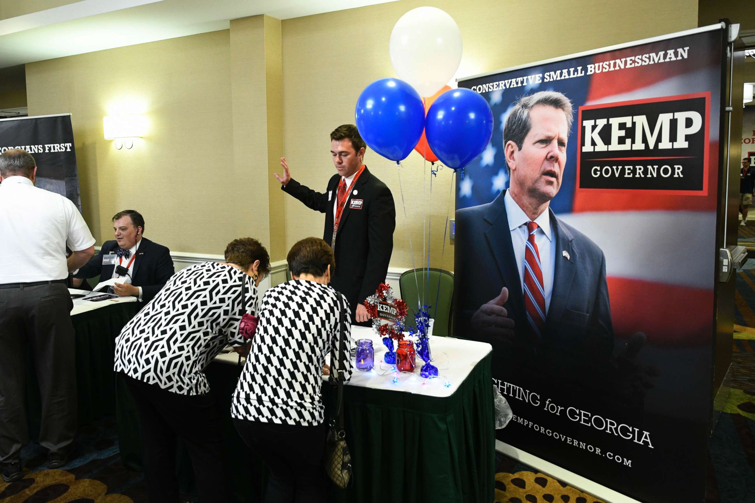PHOTO: Guests sign in to attend an election night results party for Georgia Secretary of State Brian Kemp, Republican primary candidate for governor, May 22, 2018, in Athens, Ga. 
