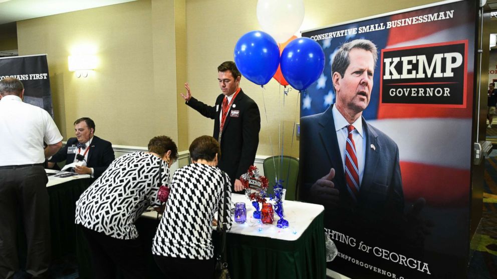 Guests sign in to attend an election night results party for Georgia Secretary of State Brian Kemp, Republican primary candidate for governor, May 22, 2018, in Athens, Ga.
