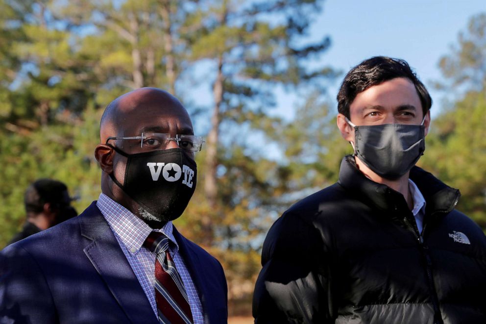 PHOTO: Democratic Senate candidates Rev. Raphael Warnock and Jon Ossoff appear together at a campaign rally ahead of Senate runoff elections in Augusta, Ga., Jan. 4, 2021.