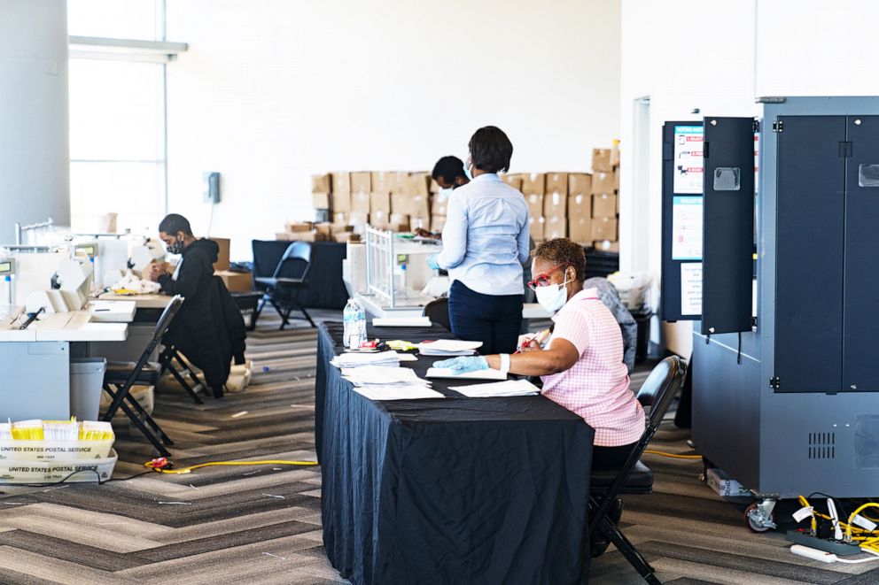 PHOTO: An election worker processes  ballots at State Farm Arena in Atlanta, Nov. 2, 2020.