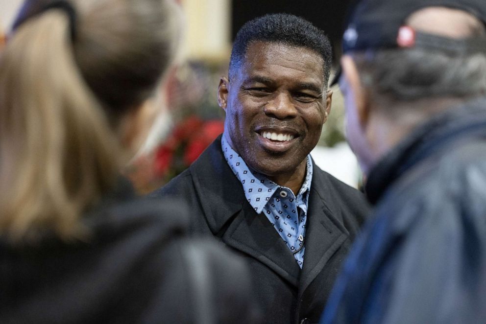 PHOTO: Senate nominee Herschel Walker talks with supporters during a rally, Nov. 21, 2022 in Milton, Georgia.