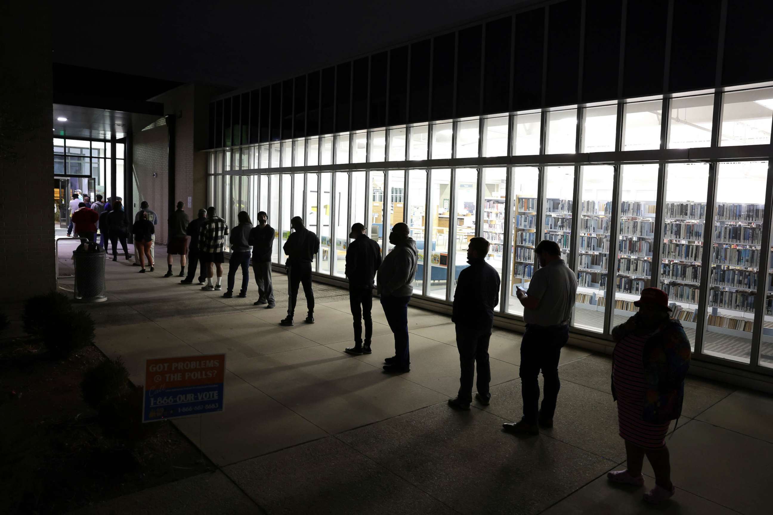 PHOTO: Residents wait in line to vote early outside a polling station, Nov. 29, 2022 in Atlanta.