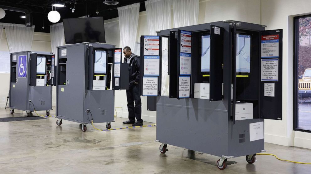 PHOTO: A voter casts his ballot at a polling station for the U.S. Senate runoff election, Dec. 6, 2022 in Atlanta.
