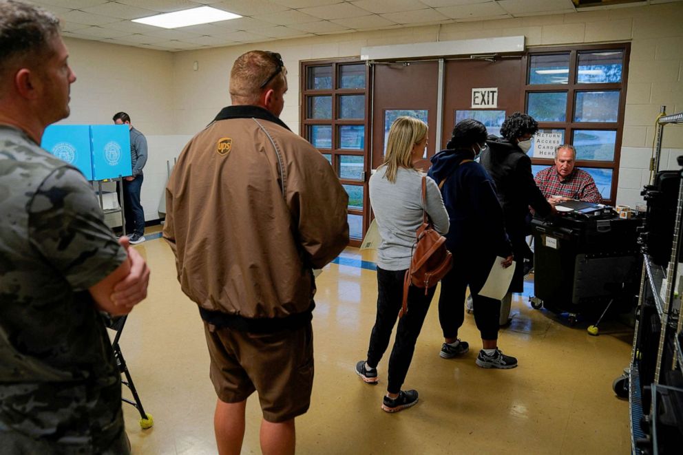PHOTO: Local residents wait in line to cast their ballots during the midterm runoff elections at Psalmond Road Recreation Center in Columbus, Georgia, Dec. 6, 2022.