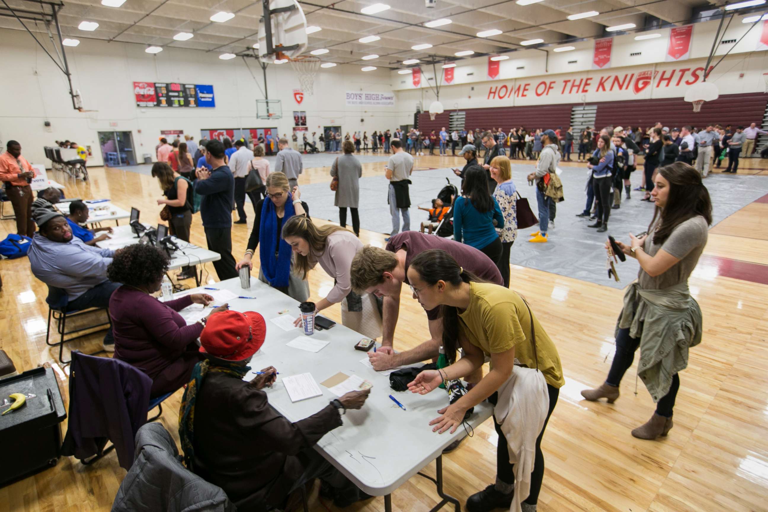 PHOTO: Voters line up to cast their ballots at a polling station set up at Grady High School for the mid-term elections, Nov. 6, 2018 in Atlanta.