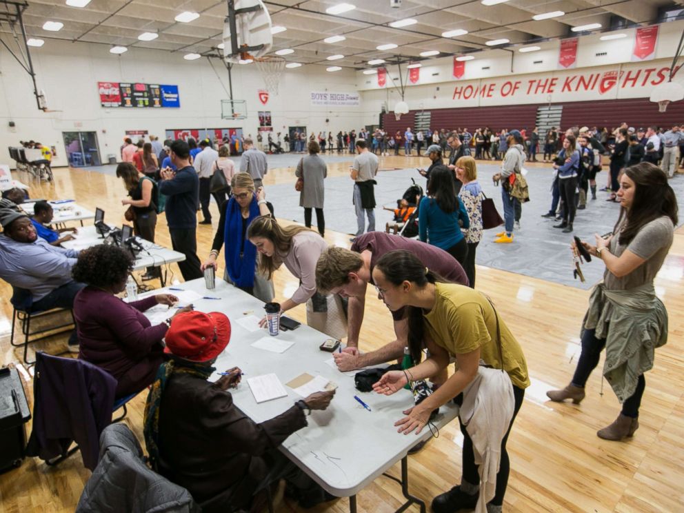 PHOTO: Voters line up to cast their ballots at a polling station set up at Grady High School for the mid-term elections, Nov. 6, 2018 in Atlanta.