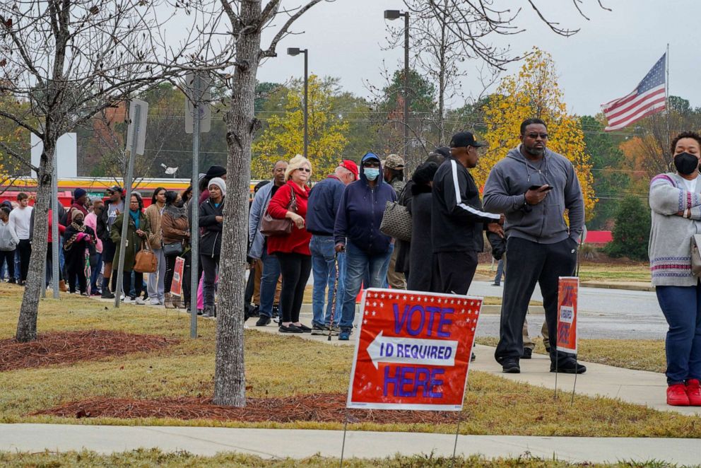 PHOTO: A line of early voters stretches outside a polling station at the City Services Center in Columbus, Ga.  REUTERS/Cheney Orr