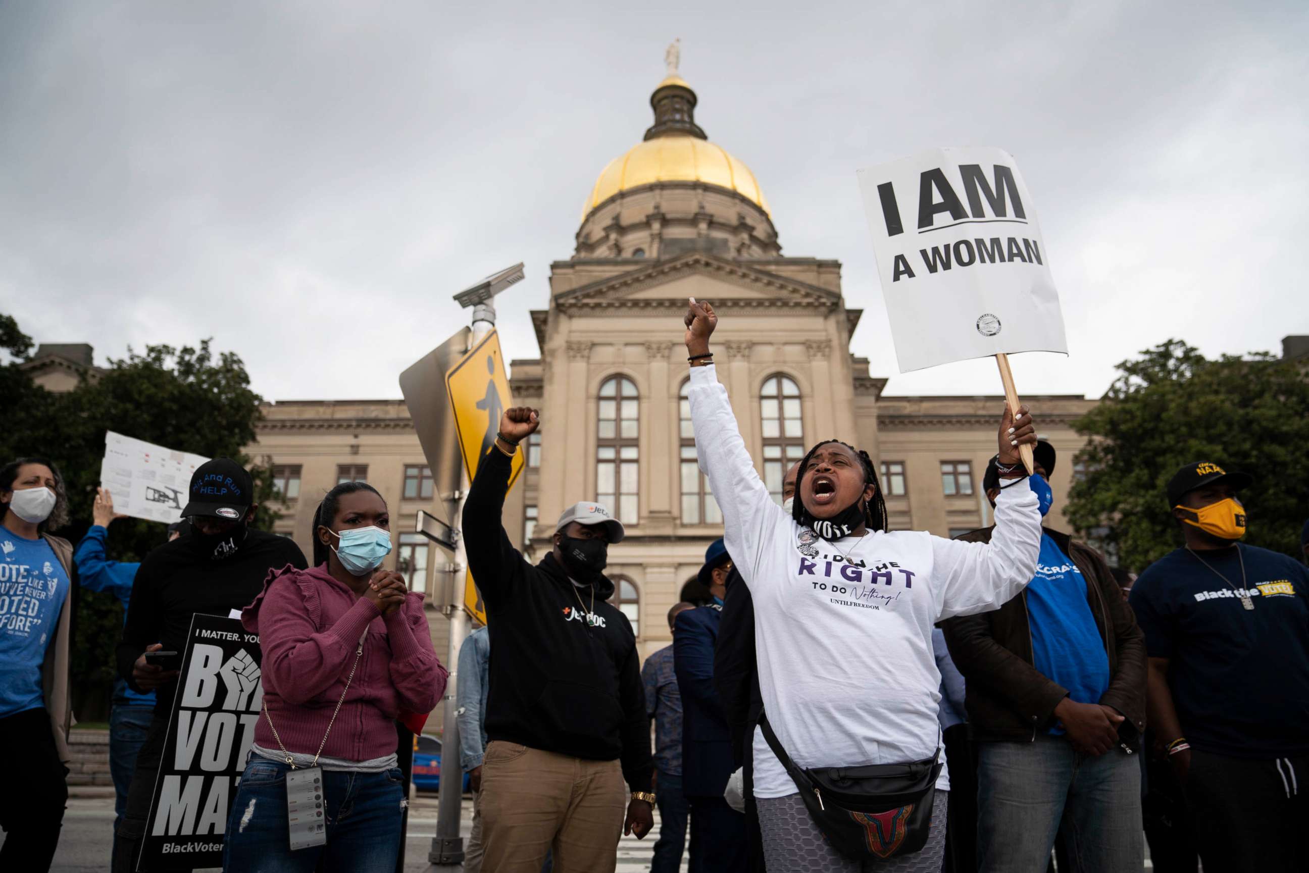 PHOTO: People protest outside the Georgia Capitol in Atlanta against a House bill on voting restrictions, March 25, 2021.