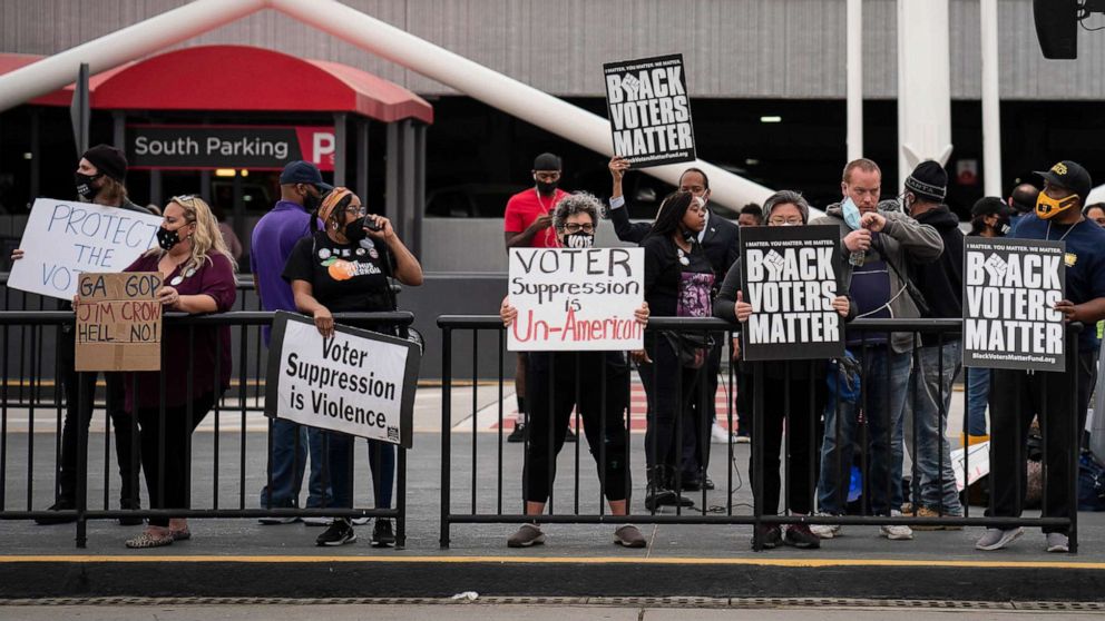 PHOTO: Voting-rights activists call for a boycott of Delta Air Lines during a protest at Hartsfield-Jackson Atlanta International Airport in Atlanta, March 25, 2021.