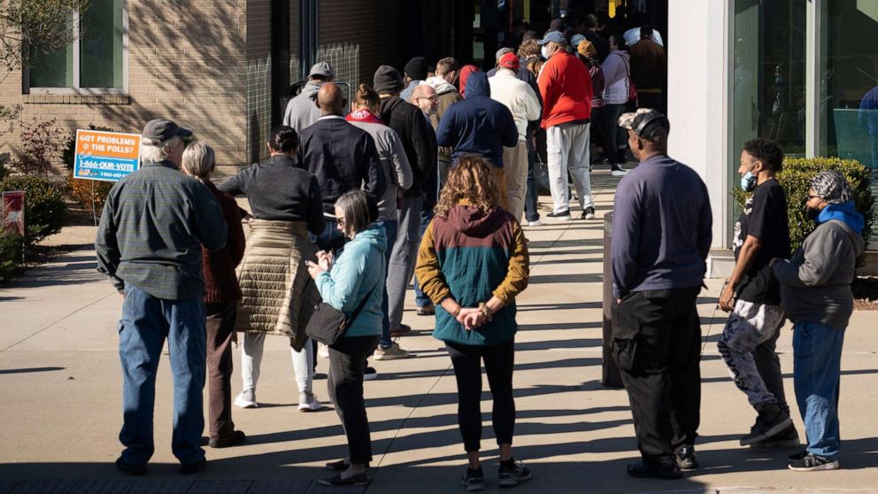 PHOTO: Voters line up at Metropolitan Library to cast their ballots in the runoff election for the Senate position, between Democratic incumbent Raphael Warnock and Republican candidate Herschel Walker, in Atlanta, on Nov. 29, 2022.