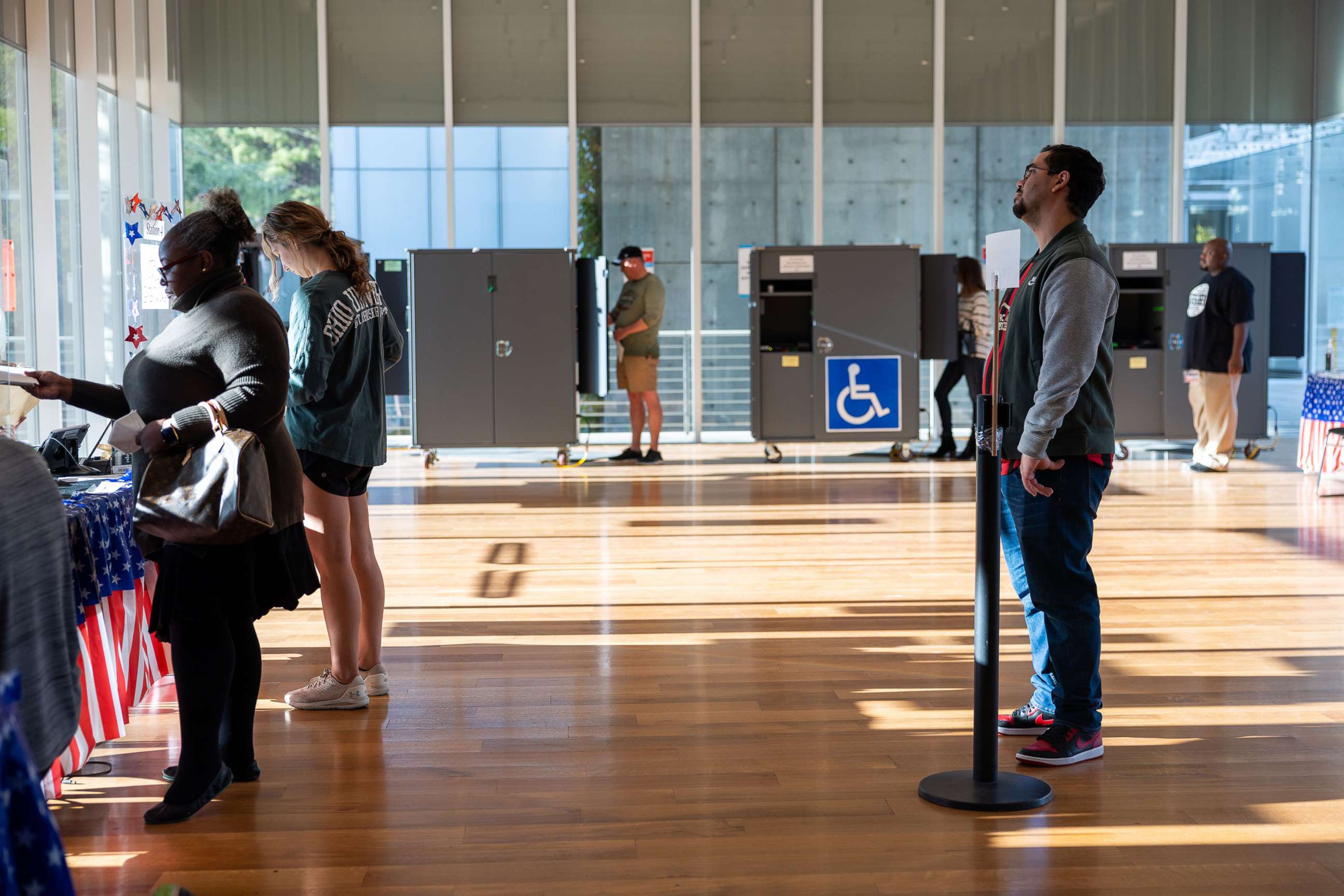 PHOTO: Georgians get ready to vote at early voting locations in Fulton County, Ga., on Oct. 22, 2022, for the November midterm elections.