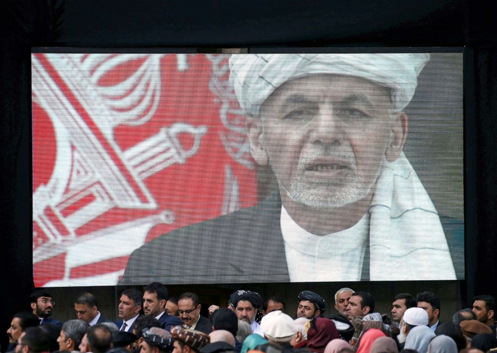 PHOTO: A screen shows the broadcast of Afghanistan's President Ashraf Ghani speaking during his inauguration as president, in Kabul, March 9, 2020. 