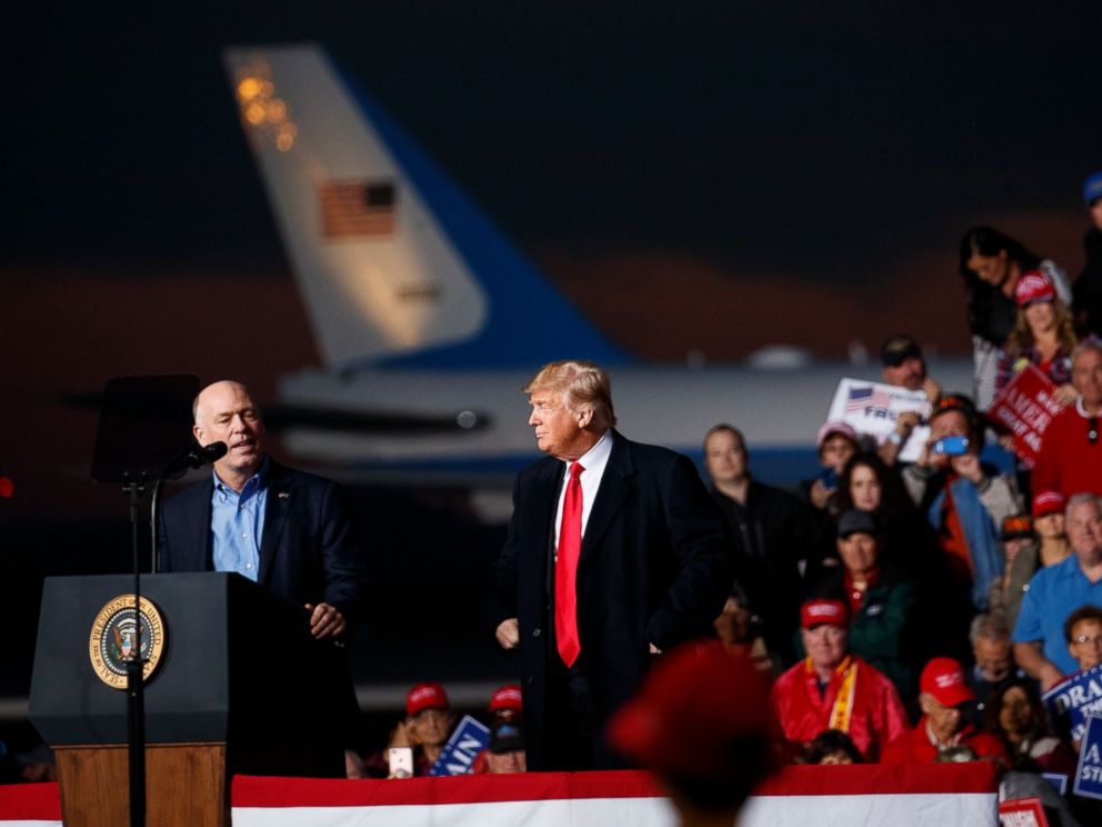 PHOTO: Rep. Greg Gianforte, R-Mont., speaks as President Donald Trump stands right during a campaign rally at Minuteman Aviation Hangar, Thursday, Oct. 18, 2018, in Missoula, Mont.