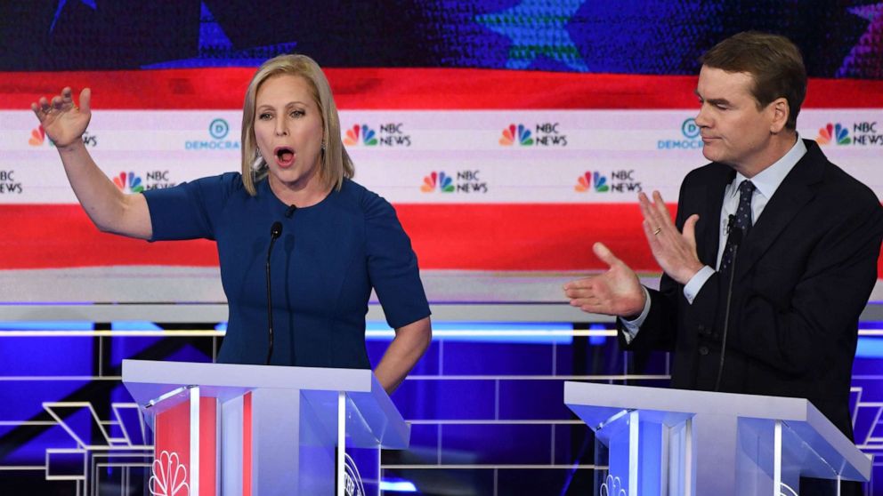 PHOTO: Kristen Gillibrand and Michael Bennet participate in the second night of the first 2020 democratic presidential debate at the Adrienne Arsht Center for the Performing Arts in Miami, June 27, 2019.