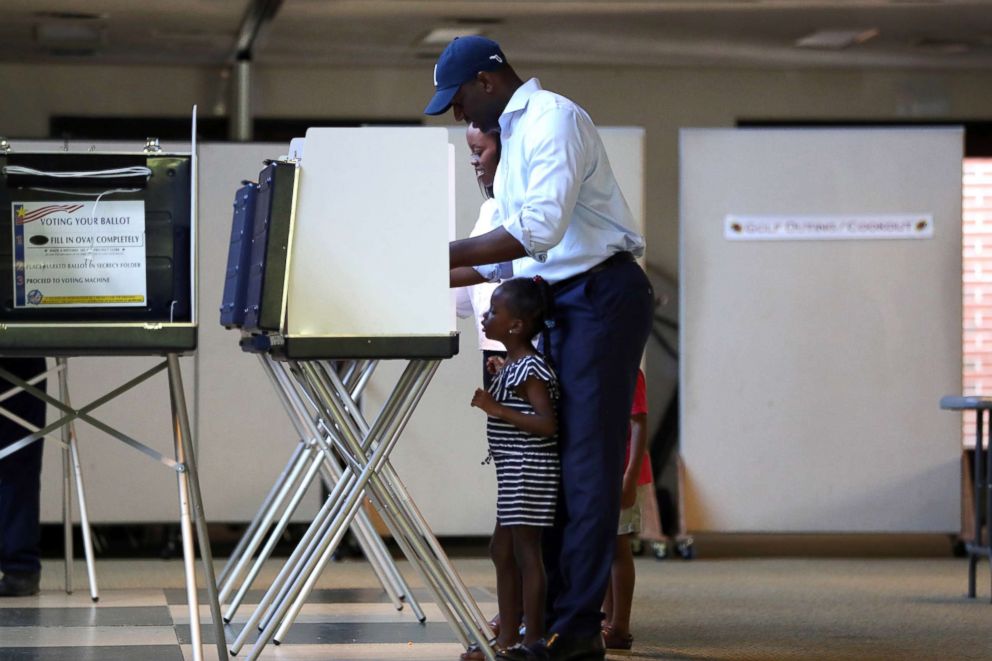 PHOTO: Florida gubernatorial candidate Andrew Gillum casts his vote, with daughter Caroline, 4, by his side at the Good Shepherd Catholic Church polling location, Aug. 28, 2018, Tallahassee, Fla. 