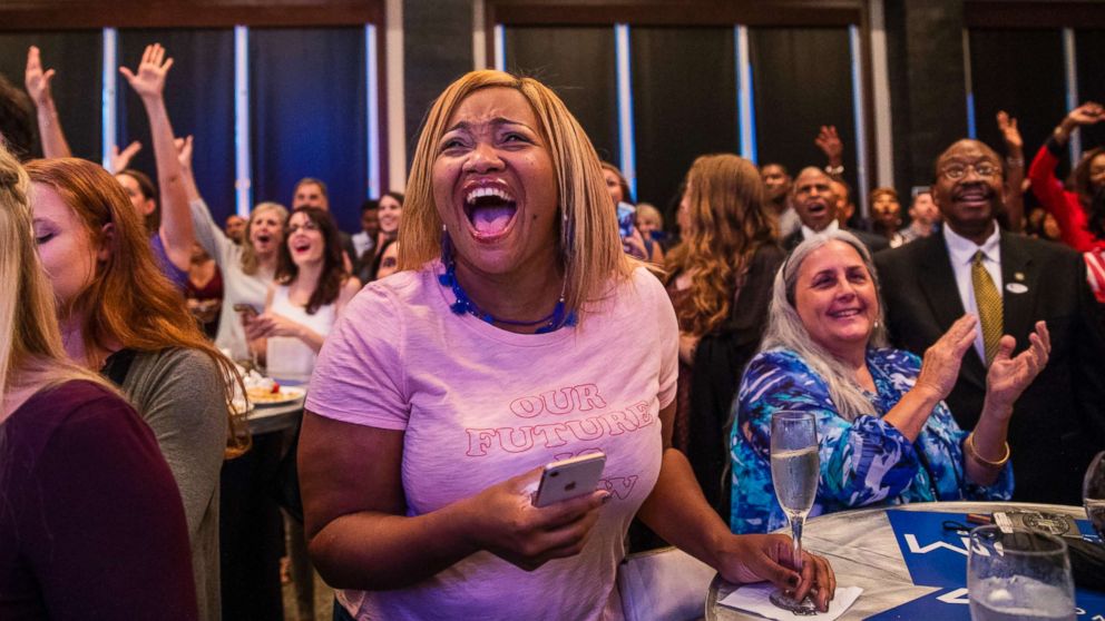 PHOTO: Dr. Atira Charles of Tallahassee, center, reacts to early results showing Andrew Gillum closing on Gwen Graham in the race to become the Democratic candidate for governor, Aug. 28, 2018, in Tallahassee, Fla.