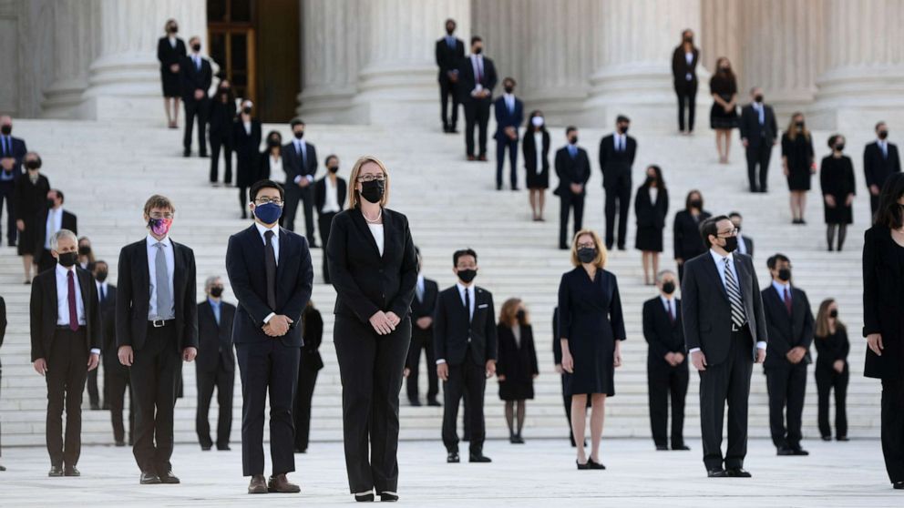 PHOTO: People wait for the casket of the late Supreme Court Justice Ruth Bader Ginsburg to arrive at the U.S. Supreme Court in Washington, D.C., Sept. 23, 2020.