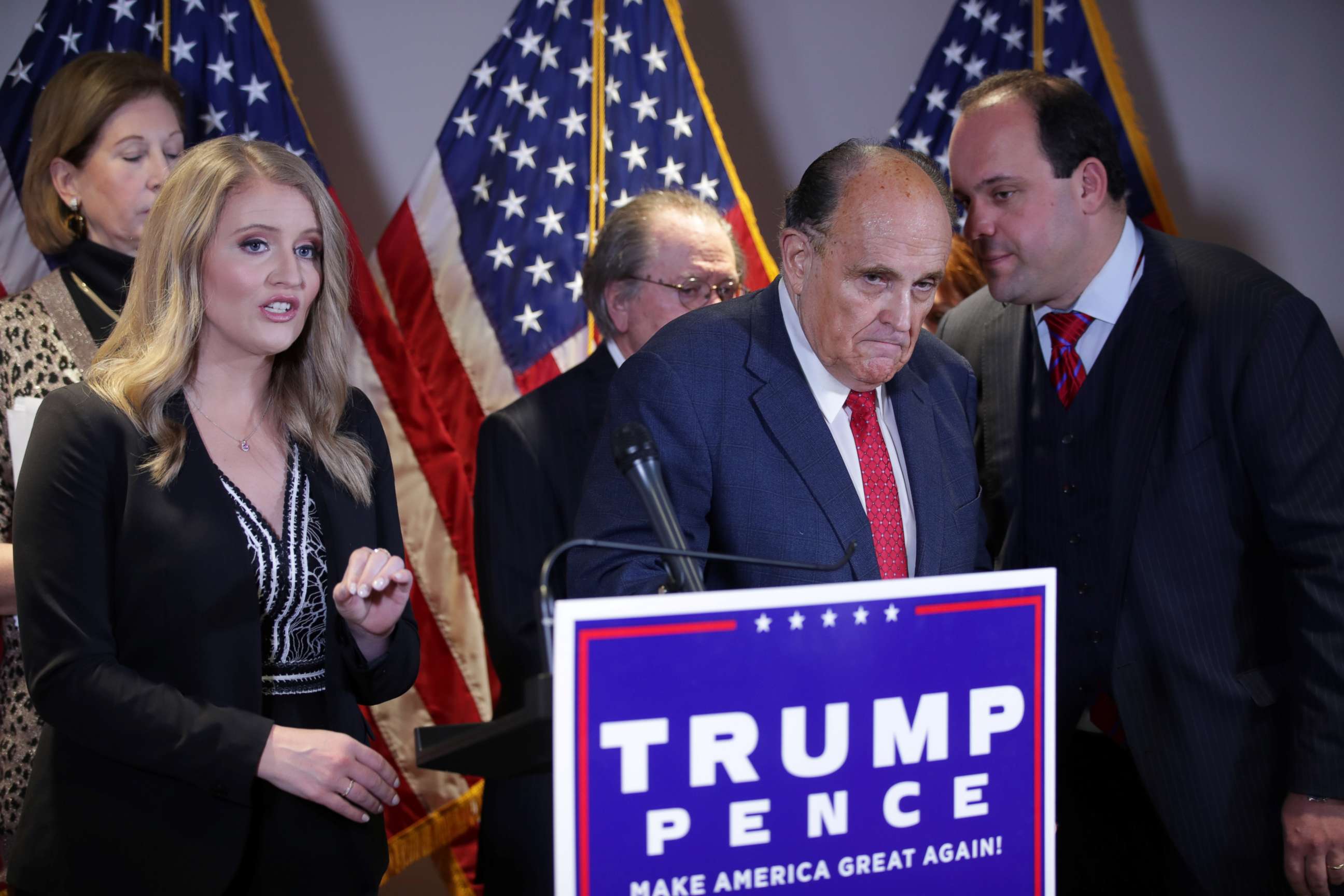 PHOTO: Trump Campaign Senior Legal Adviser Jenna Ellis speaks as Trump campaign adviser Boris Epshteyn whispers to Rudy Giuliani, personal attorney to President Donald Trump, during a news conference in Washington, Nov. 19, 2020.