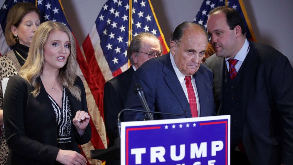 PHOTO: Trump Campaign Senior Legal Adviser Jenna Ellis speaks as Trump campaign adviser Boris Epshteyn whispers to Rudy Giuliani, personal attorney to President Donald Trump, during a news conference in Washington, Nov. 19, 2020.