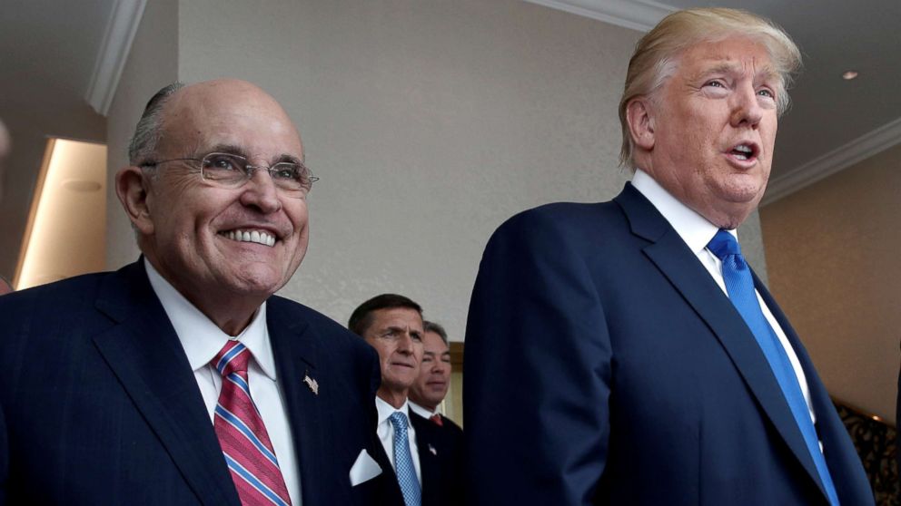 File photo of Republican presidential nominee Donald Trump with former New York City mayor Rudolph Giuliani, left, at the new Trump International Hotel, Sept. 16, 2016, in Washington, D.C.