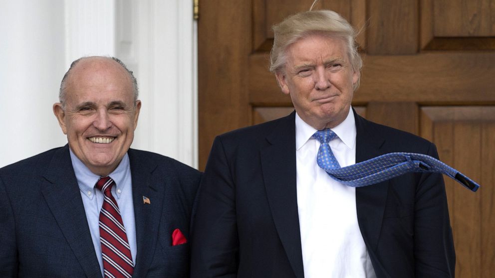 PHOTO: President Donald Trump meets with former New York City Mayor Rudy Giuliani at the clubhouse of the Trump National Golf Club in Bedminster, New Jersey.