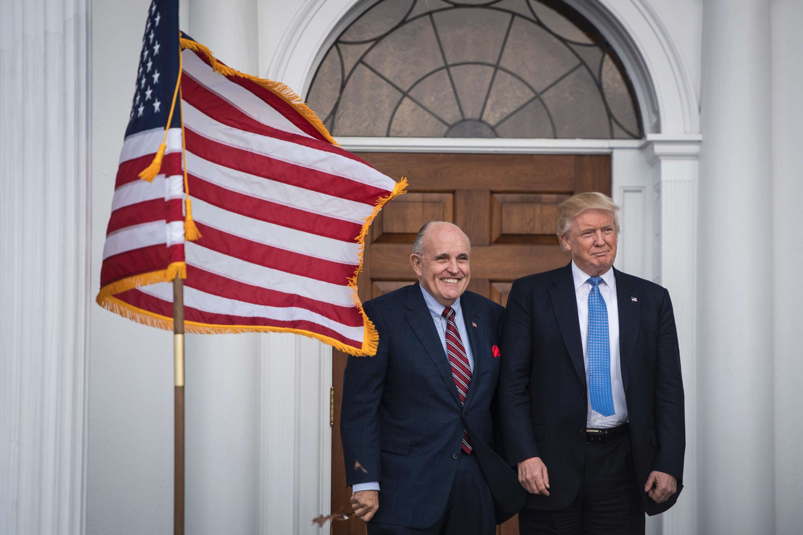 PHOTO: Rudy Giuliani greets President-elect Donald Trump at the clubhouse at Trump National Golf Club Bedminster in Bedminster Township, N.J., Nov. 20, 2016.