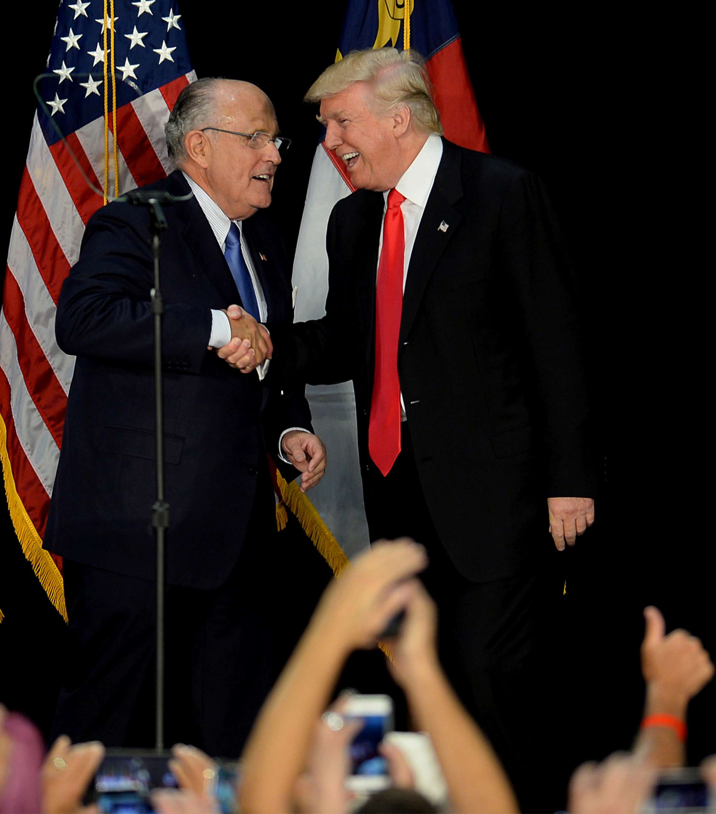 PHOTO: In this file photo, former New York City mayor Rudy Giuliani welcomes Republican presidential candidate Donald Trump on stage during a campaign rally in Charlotte, N.C., Aug. 18, 2016.